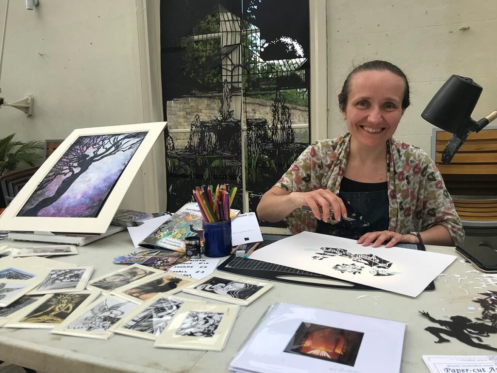 Artist Lois Cordelia demonstrating her skills at the Cobbold 300 Event. Photo: David Vincent